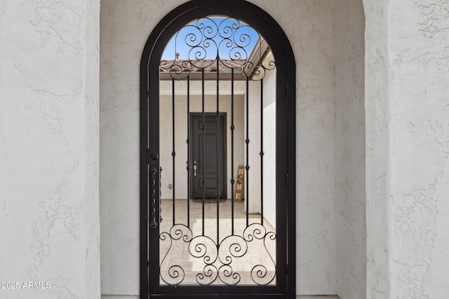 31490 N 126th Ln, Peoria, AZ 85383 - doorway to property with stucco siding and a gate
