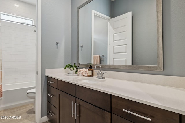 31490 N 126th Ln, Peoria, AZ 85383 - bathroom featuring toilet, wood finished floors, vanity, and shower / washtub combination