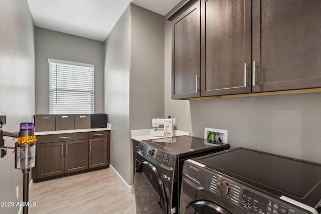31490 N 126th Ln, Peoria, AZ 85383 - laundry area featuring washer and clothes dryer, baseboards, and cabinet space