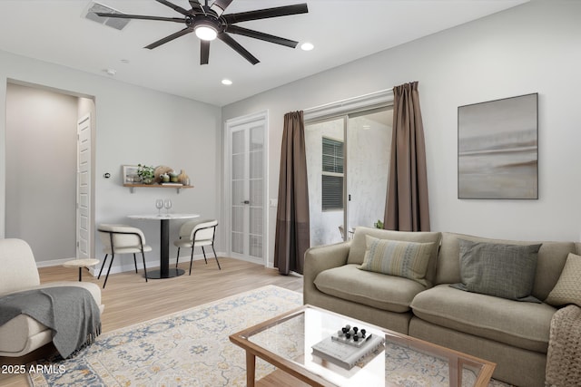 31490 N 126th Ln, Peoria, AZ 85383 - living room featuring light wood-type flooring, baseboards, a ceiling fan, and recessed lighting