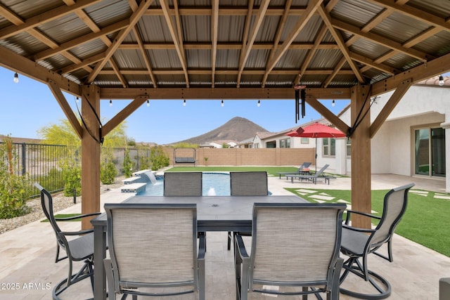 31490 N 126th Ln, Peoria, AZ 85383 - view of patio / terrace featuring a fenced in pool, a gazebo, outdoor dining area, and a mountain view