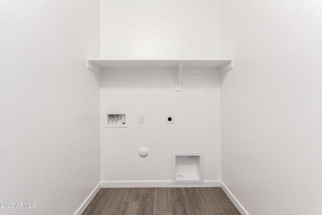 laundry room featuring dark wood-style flooring, laundry area, gas dryer hookup, electric dryer hookup, and hookup for a washing machine