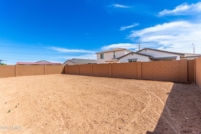 view of yard featuring a fenced backyard