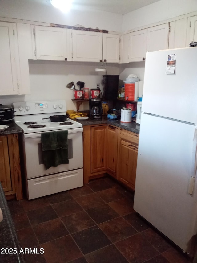 102 N Verdugo Pl, Mammoth, AZ 85618 - kitchen with white appliances, dark countertops, and white cabinets