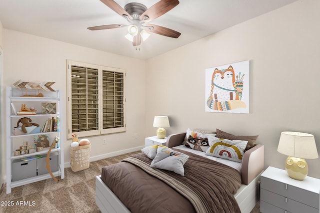 carpeted bedroom featuring baseboards and a ceiling fan