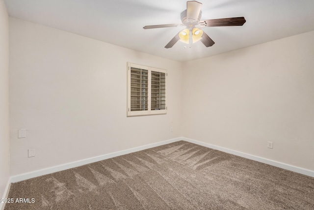empty room with carpet flooring, baseboards, and ceiling fan