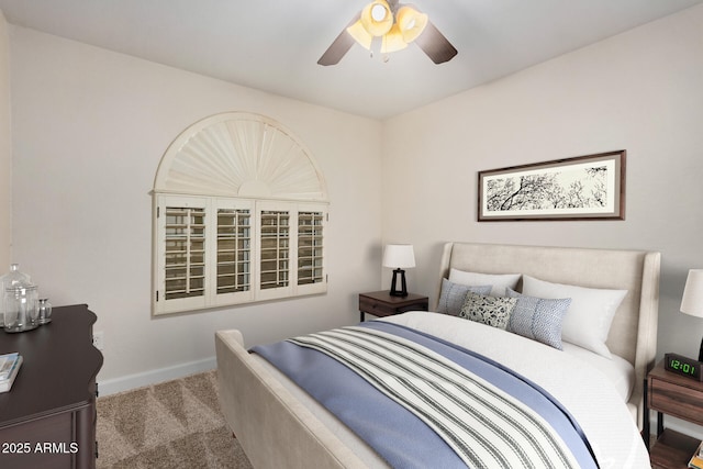 bedroom featuring carpet flooring, baseboards, and a ceiling fan