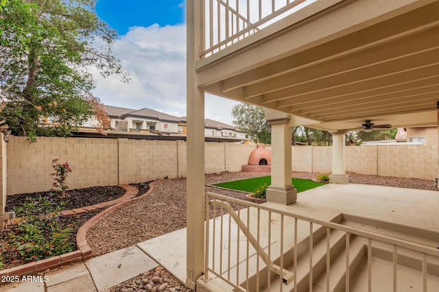 view of patio / terrace featuring a fenced backyard and a ceiling fan