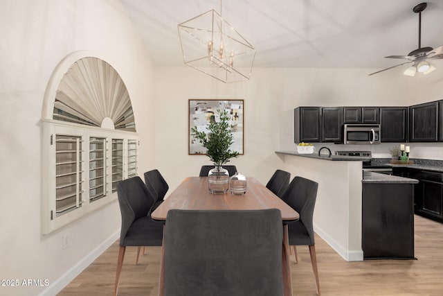 dining room with baseboards, light wood-style flooring, a chandelier, and ceiling fan