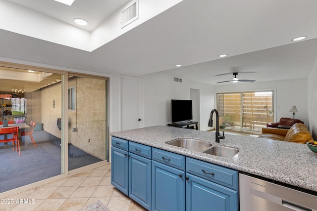 kitchen with open floor plan, dishwasher, visible vents, and a sink