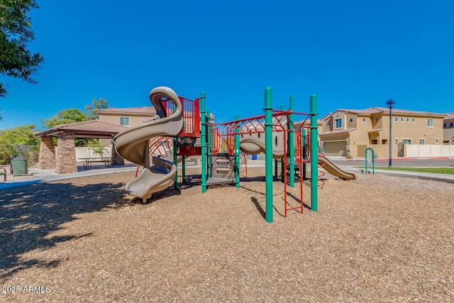community jungle gym featuring fence