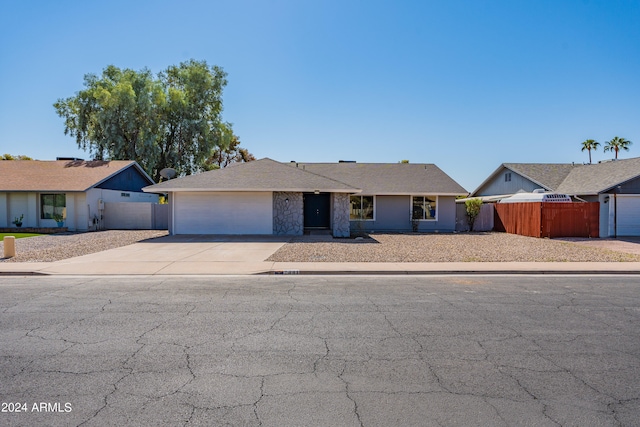 ranch-style home featuring a garage