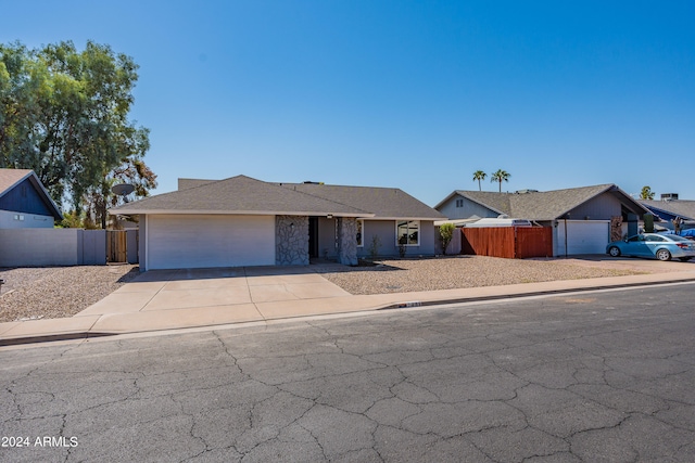 ranch-style home featuring a garage