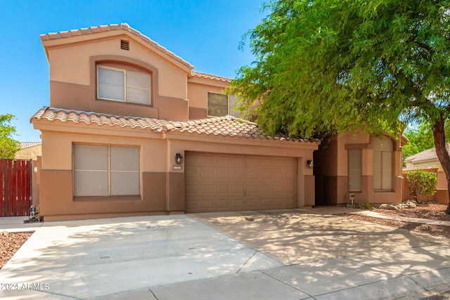 mediterranean / spanish-style house featuring a garage