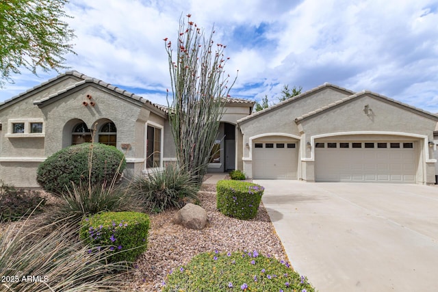 2600 E Hazeltine Way, Chandler, AZ 85249 - mediterranean / spanish home featuring a tile roof, stucco siding, an attached garage, and concrete driveway