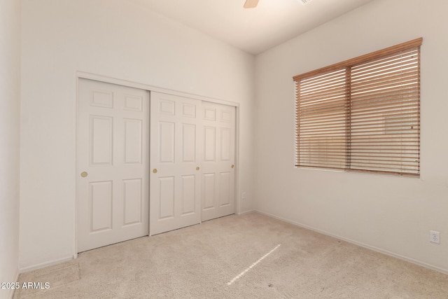 2600 E Hazeltine Way, Chandler, AZ 85249 - unfurnished bedroom with baseboards, a closet, carpet floors, and a ceiling fan