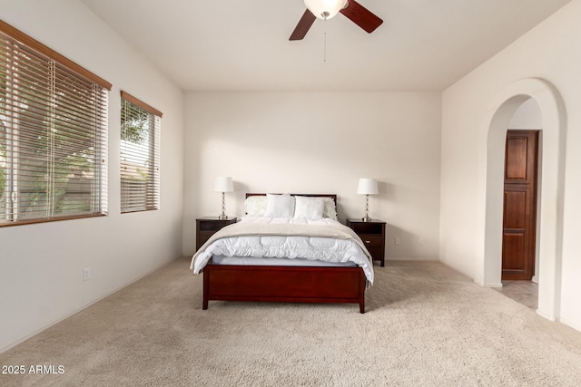 2600 E Hazeltine Way, Chandler, AZ 85249 - carpeted bedroom with arched walkways and a ceiling fan