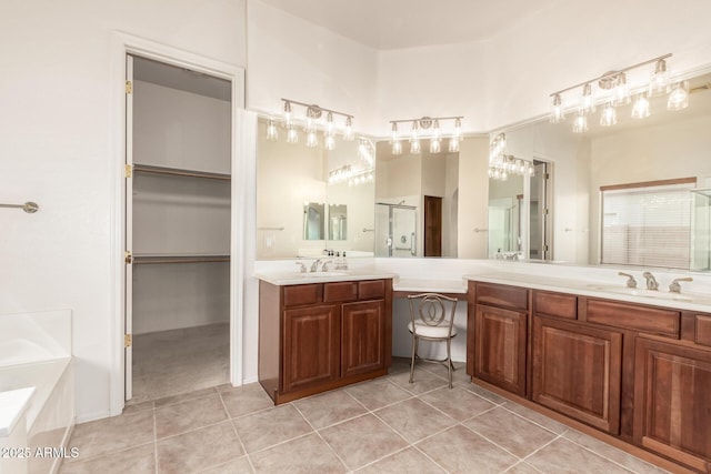 2600 E Hazeltine Way, Chandler, AZ 85249 - bathroom featuring a bath, tile patterned floors, vanity, a stall shower, and a walk in closet
