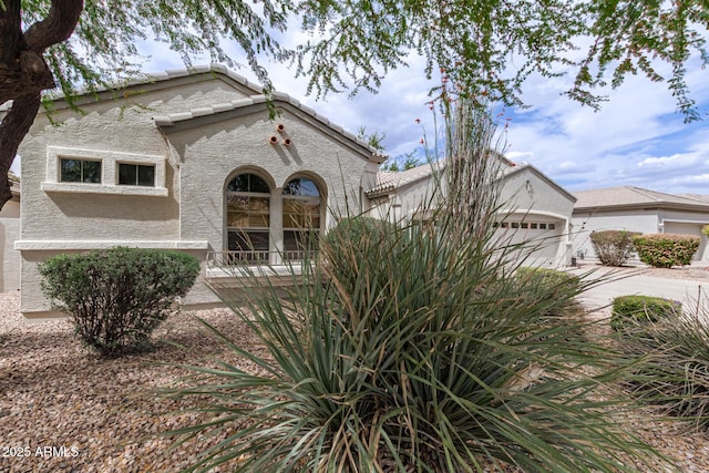 2600 E Hazeltine Way, Chandler, AZ 85249 - view of front of property featuring a garage, concrete driveway, and stucco siding