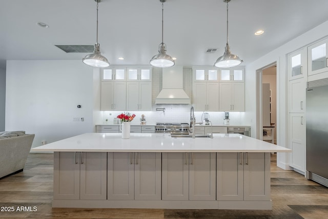 22709 S 202nd St, Queen Creek, AZ 85142 - kitchen featuring custom exhaust hood, premium appliances, backsplash, a spacious island, and a sink