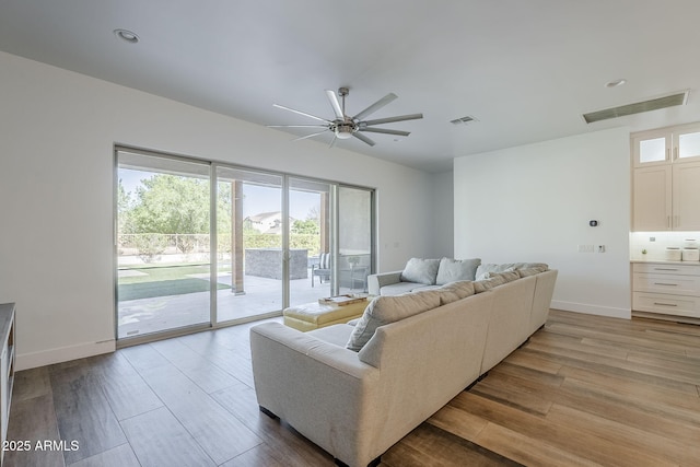 22709 S 202nd St, Queen Creek, AZ 85142 - living room featuring wood finished floors, a ceiling fan, and baseboards