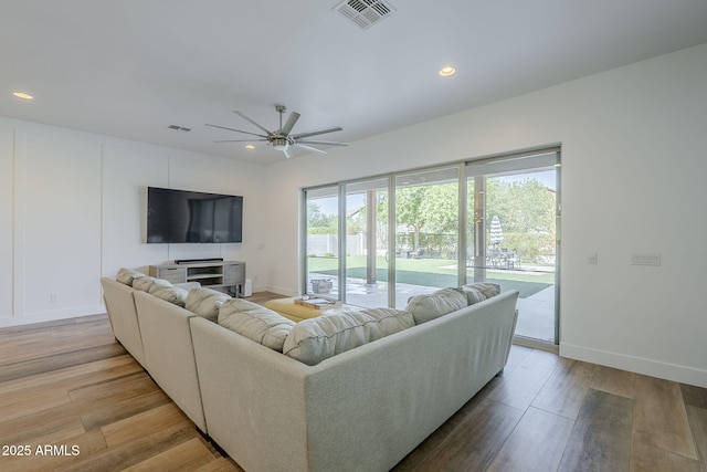 22709 S 202nd St, Queen Creek, AZ 85142 - living area featuring light wood finished floors, a ceiling fan, recessed lighting, and baseboards