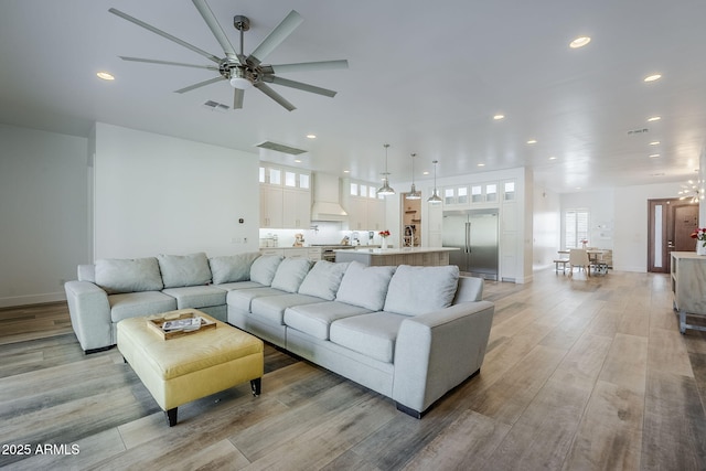 22709 S 202nd St, Queen Creek, AZ 85142 - living room with recessed lighting, ceiling fan, light wood-type flooring, and baseboards
