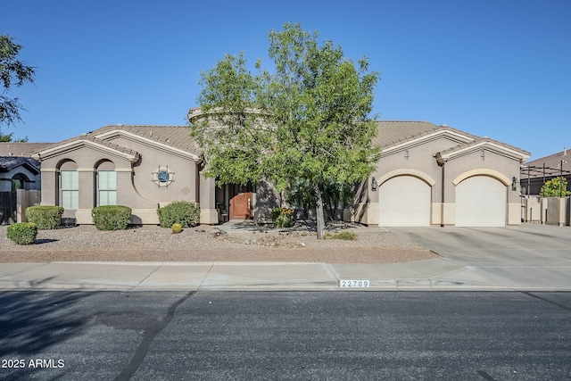 22709 S 202nd St, Queen Creek, AZ 85142 - view of front of home featuring stucco siding, a garage, concrete driveway, and a tile roof