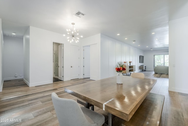 22709 S 202nd St, Queen Creek, AZ 85142 - dining room featuring a chandelier, light wood finished floors, recessed lighting, and baseboards