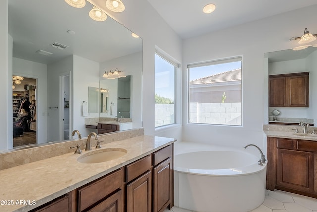 22709 S 202nd St, Queen Creek, AZ 85142 - full bath with a garden tub, two vanities, a spacious closet, and tile patterned flooring