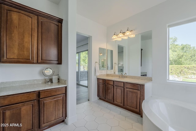 22709 S 202nd St, Queen Creek, AZ 85142 - bathroom featuring healthy amount of natural light, a bath, vanity, and tile patterned floors
