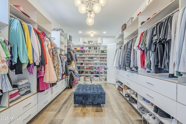 22709 S 202nd St, Queen Creek, AZ 85142 - walk in closet with light wood finished floors and a chandelier