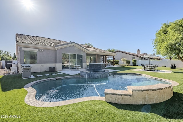 22709 S 202nd St, Queen Creek, AZ 85142 - rear view of property with a patio area, stucco siding, a pool with connected hot tub, and a tiled roof