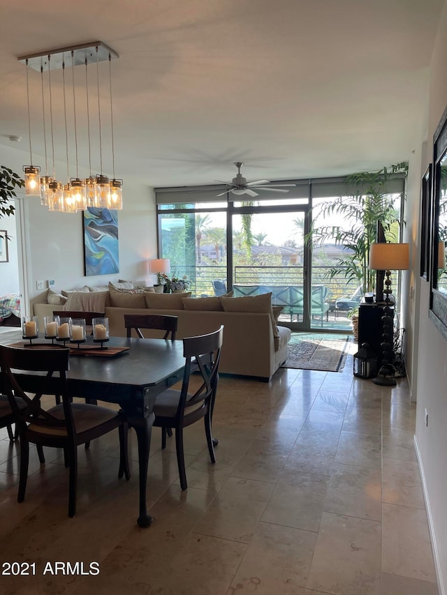 dining area with ceiling fan with notable chandelier