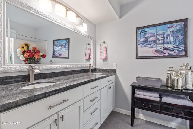 bathroom with vanity and tile patterned flooring