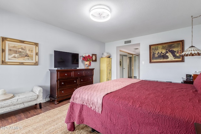 bedroom featuring wood-type flooring