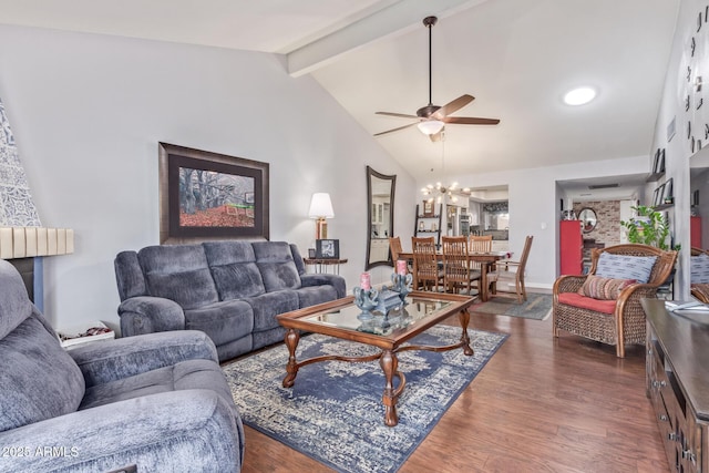 living room featuring dark hardwood / wood-style floors, ceiling fan with notable chandelier, and vaulted ceiling with beams