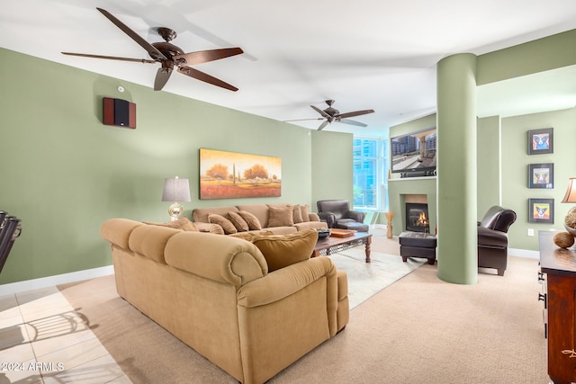 living room featuring light tile patterned floors and ceiling fan