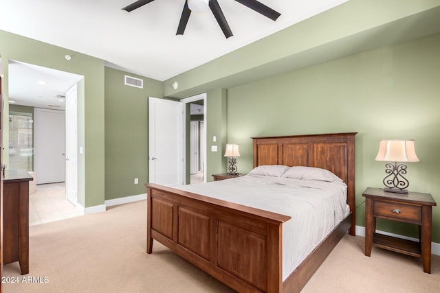 120 E Rio Salado Pkwy Unit 201, Tempe, AZ 85281 - bedroom featuring light colored carpet, baseboards, ceiling fan, and ensuite bath