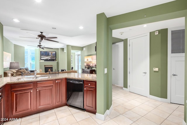 120 E Rio Salado Pkwy Unit 201, Tempe, AZ 85281 - kitchen featuring black dishwasher, a sink, a warm lit fireplace, ceiling fan, and open floor plan