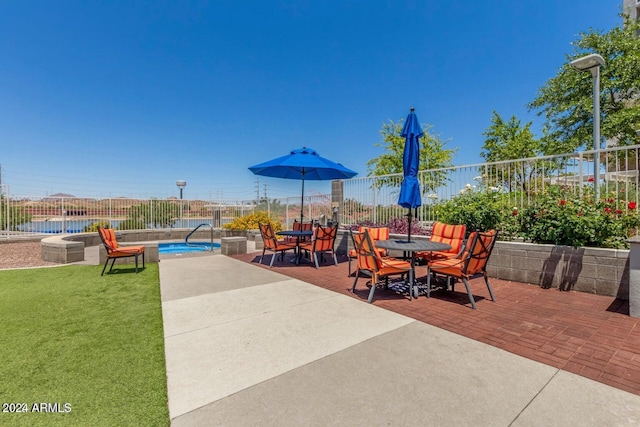 120 E Rio Salado Pkwy Unit 201, Tempe, AZ 85281 - view of patio / terrace featuring a pool and outdoor dining space