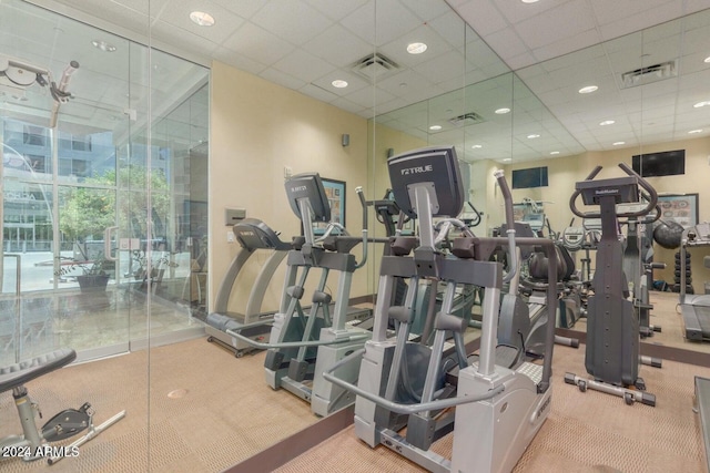 exercise room with a drop ceiling