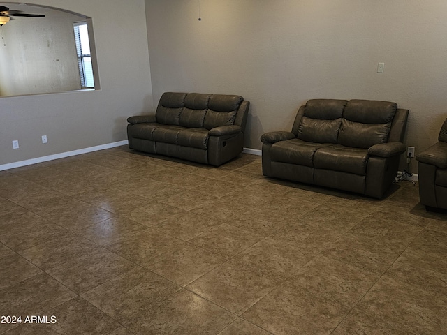 unfurnished living room featuring ceiling fan