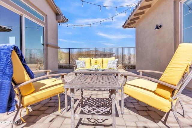 balcony featuring outdoor lounge area and a patio