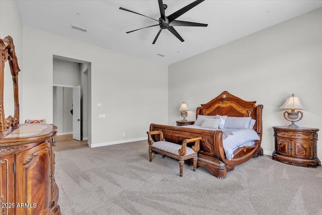 carpeted bedroom featuring visible vents, baseboards, and ceiling fan