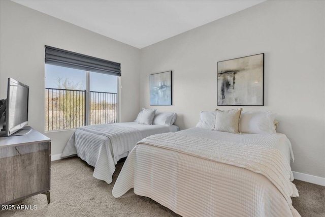 bedroom with carpet and baseboards