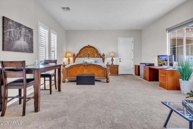 bedroom featuring light carpet and visible vents