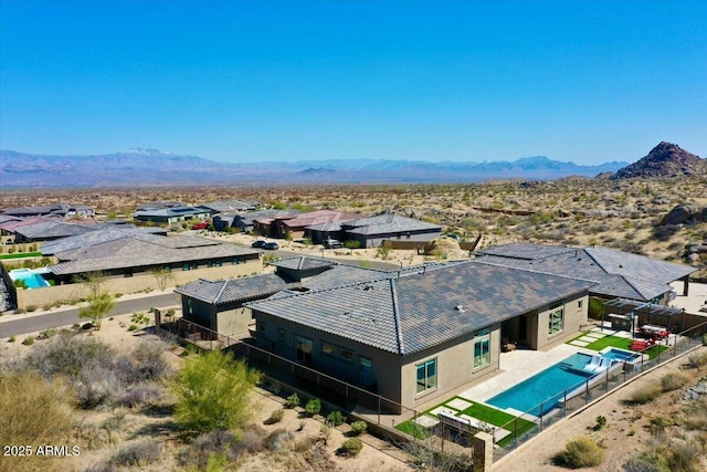 birds eye view of property featuring a mountain view