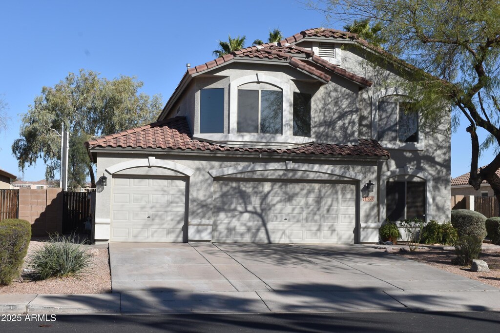 1353 S Western Skies Dr, Gilbert, AZ 85296 - mediterranean / spanish house with a tile roof and stucco siding