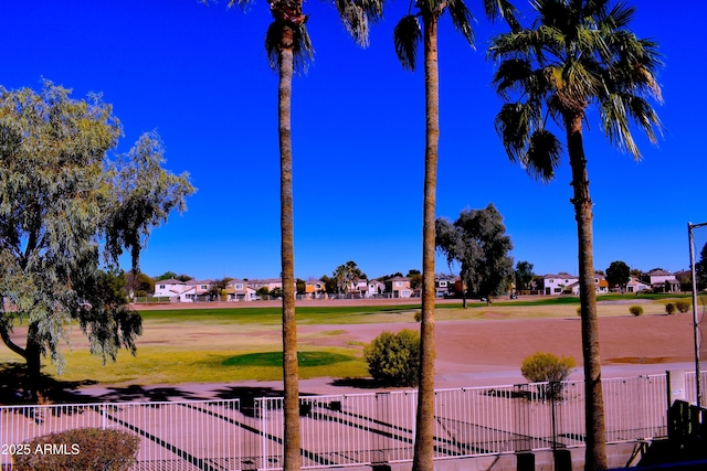 exterior space with a residential view and fence